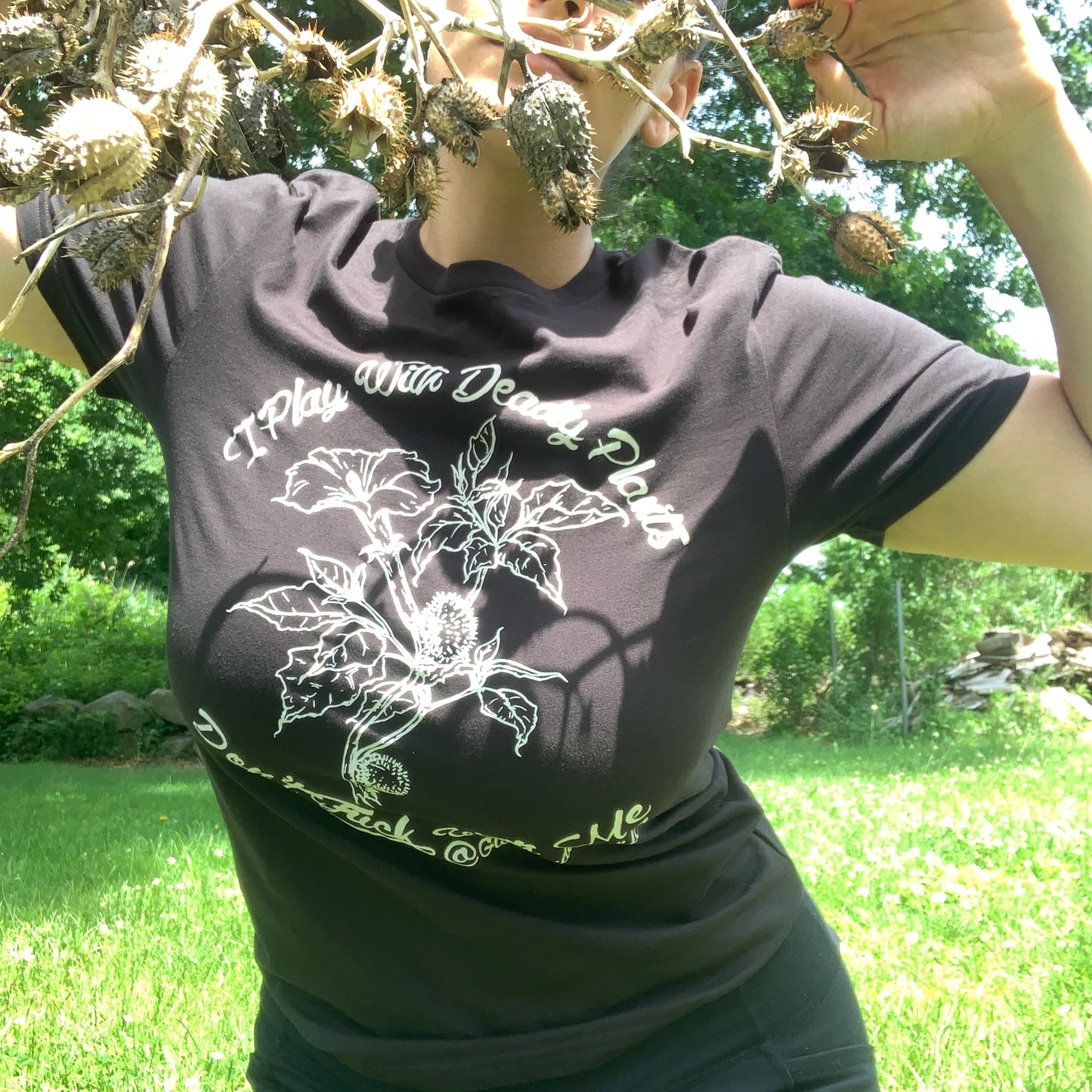 I play with deadly plants, don't f*ck with me featuring datura stramonium (angel's trumpet) organic cotton t-shirt