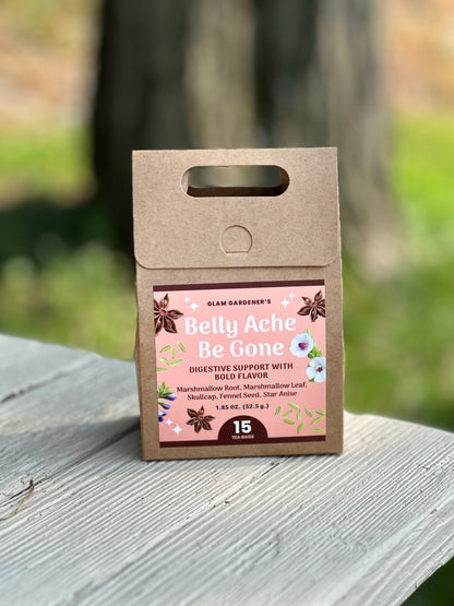 A kraft paper pouch of Islam Gardener's Belly Ache Be Gone digestive support stands on a weathered wooden surface with a blurred outdoor background. Across many cultures, fennel seed is consumed after meals to help the body digest. Skullcap is a plant native to America known to calm the body. Combined with Marshmallow, Belly Ache Be Gone works to soothe an irritable belly. These medicinal plants are also known for their unique flavors and anti-inflammatory properties.