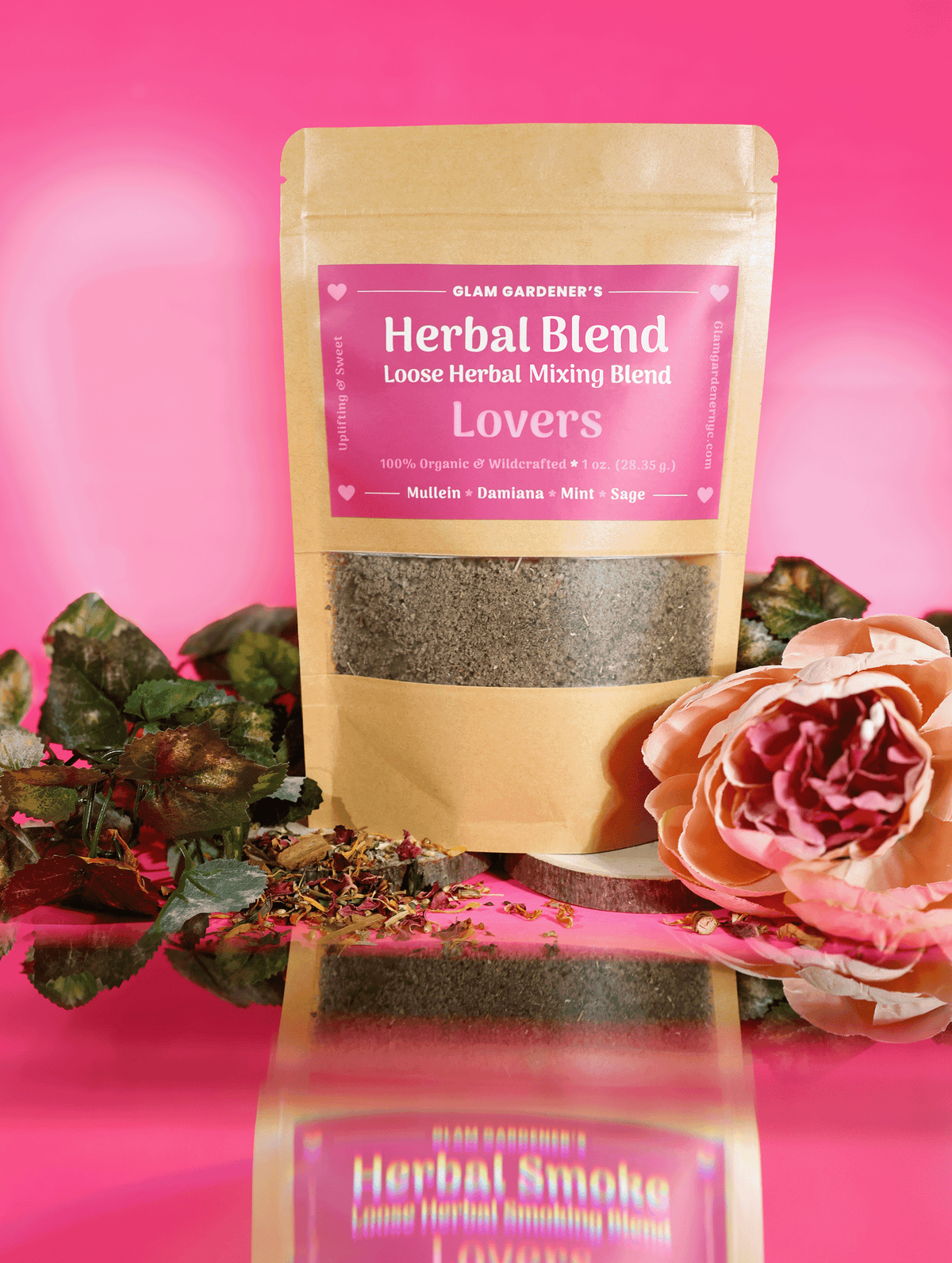 Glam Gardener's Pre-ground Herbal Mixing Blend with Mullein, Damiana, Mint, and Sage. All ingredients are organic, wildcrafted, and pre-ground finely. The label is pink, the stand up pouch is brown and the background is pink with green ivy and a pink rose. 