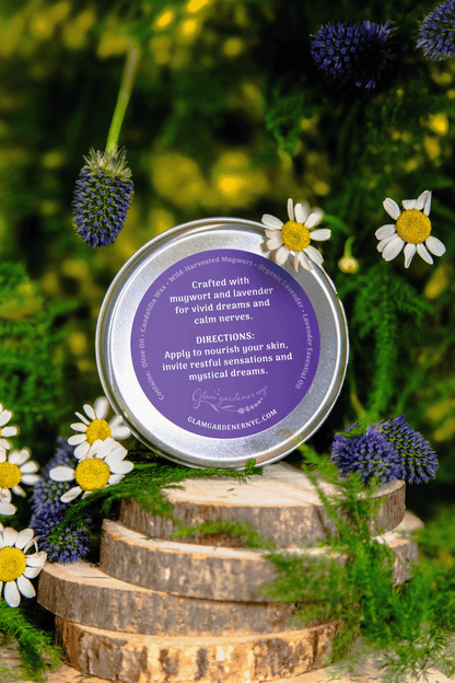 Vegan Mystic Dreams Scented Salve by Glam Gardener NYC back label. A product made with 100% vegan and natural ingredients by Glam Gardener NYC. A scented salve with mugwort and lavender infused for sweet dreams, aromatherapy and perfume. Ingredients are olive oil, candelilla wax, mugwort, lavender, and lavender essential oil. 