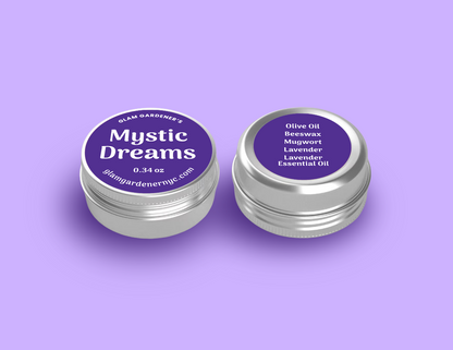 Glam Gardener's mini mystic dreams salve is a mini version of our standard sized salve with lavender, mugwort, olive oil, lavender essential oil, and beeswax. It smells like lavender. The image shows the salve enlarged for readability with a purple label and a purple background. The salve is available at glamgardenernyc.com