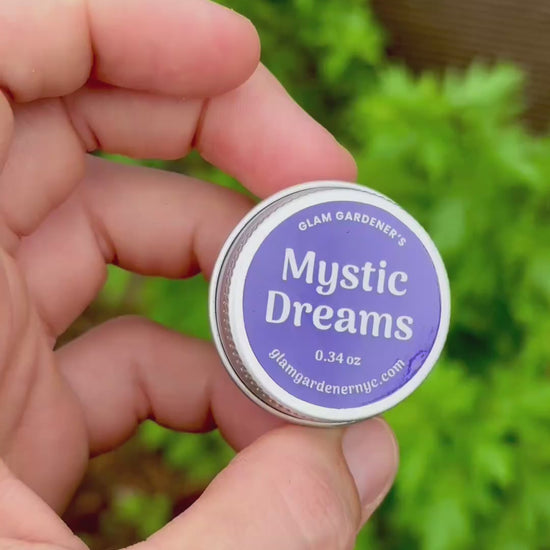 Mystic Dreams Mini Salve by Glam Gardener with Mugwort and Garden in Background. 